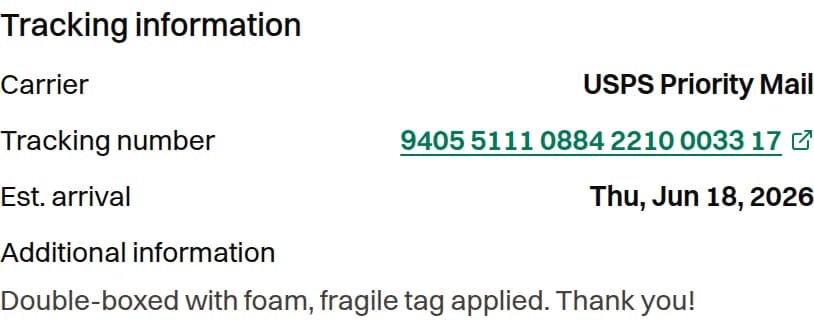 Tracking information panel showing the tracking number as a link to the carrier